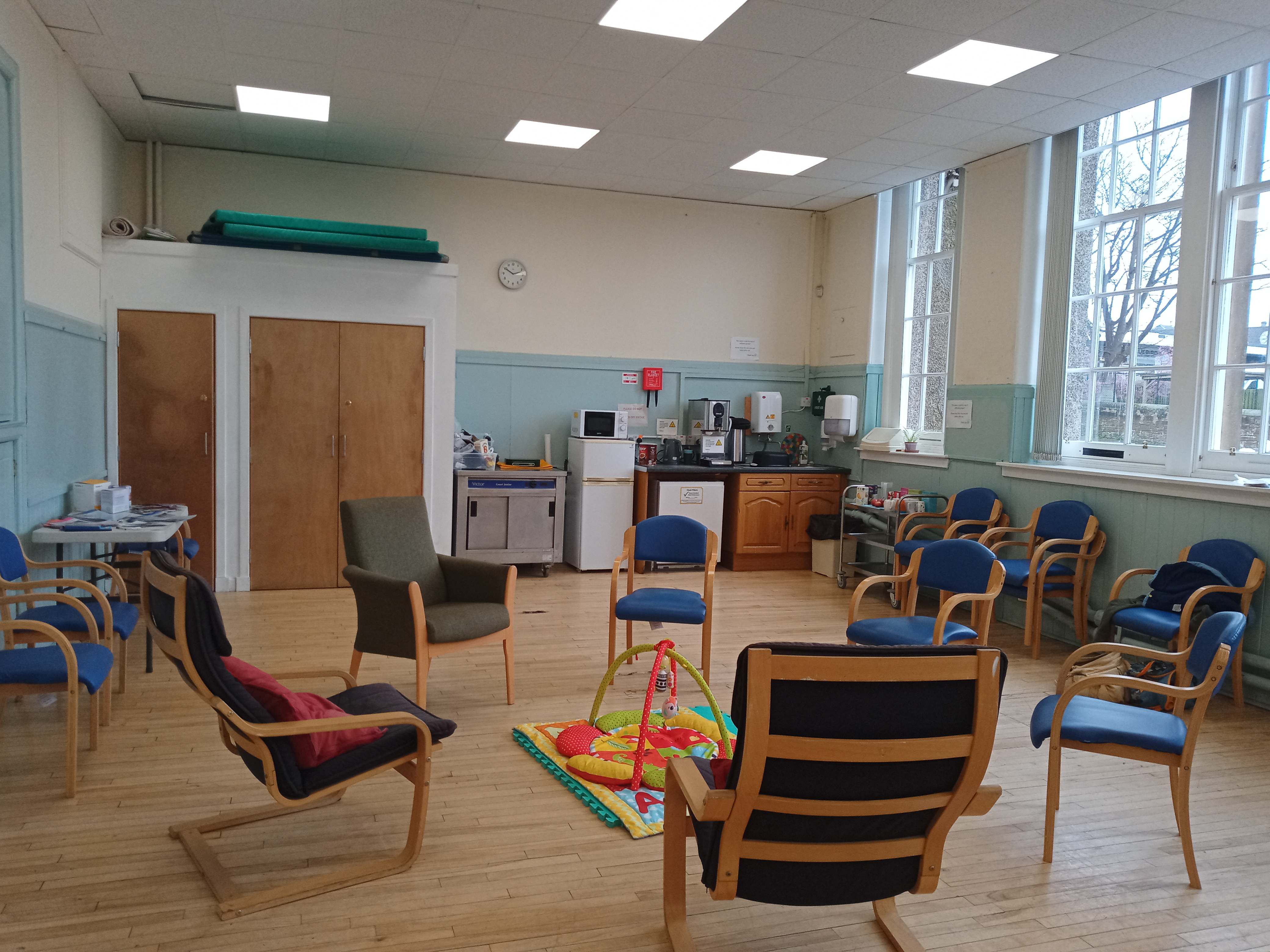 Gilmerton meeting hall with armchairs and baby toys